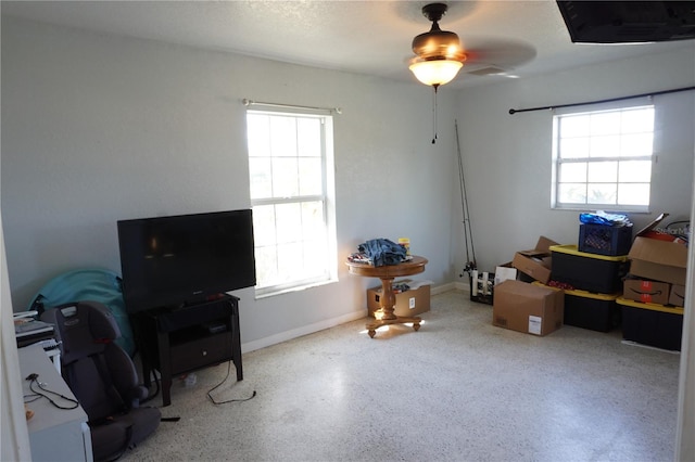 miscellaneous room featuring plenty of natural light and a textured ceiling