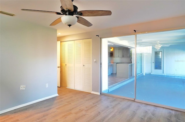 unfurnished bedroom featuring ceiling fan and light hardwood / wood-style flooring