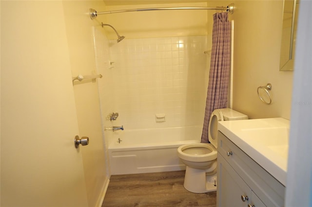 full bathroom featuring vanity, toilet, wood-type flooring, and shower / bath combo