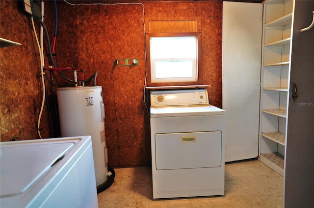 clothes washing area with washer / clothes dryer and water heater