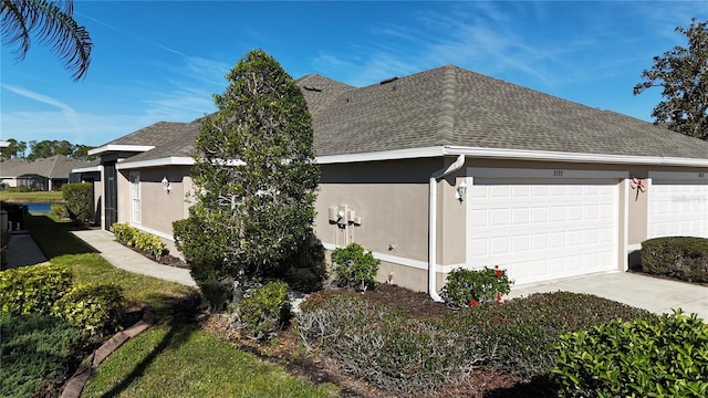 view of property exterior featuring a garage