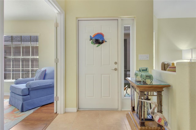 tiled foyer entrance with a wealth of natural light