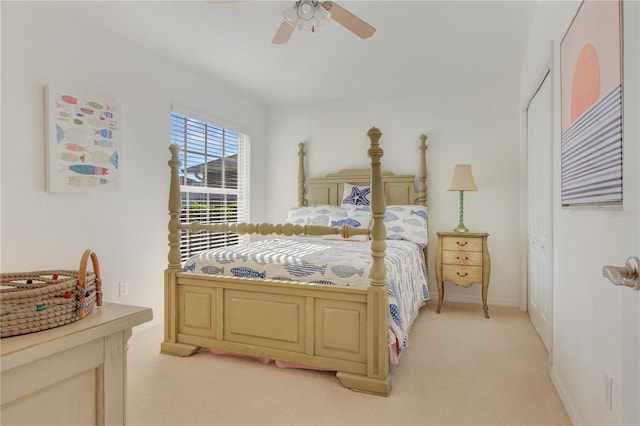 bedroom featuring ceiling fan and light carpet