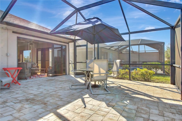 view of patio / terrace featuring a lanai