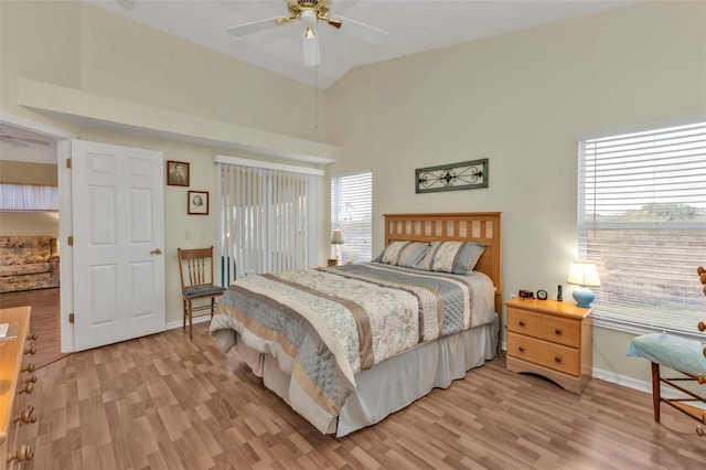 bedroom featuring ceiling fan, high vaulted ceiling, and light hardwood / wood-style floors