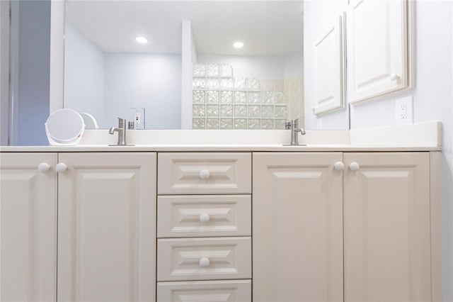 bathroom featuring vanity and a shower