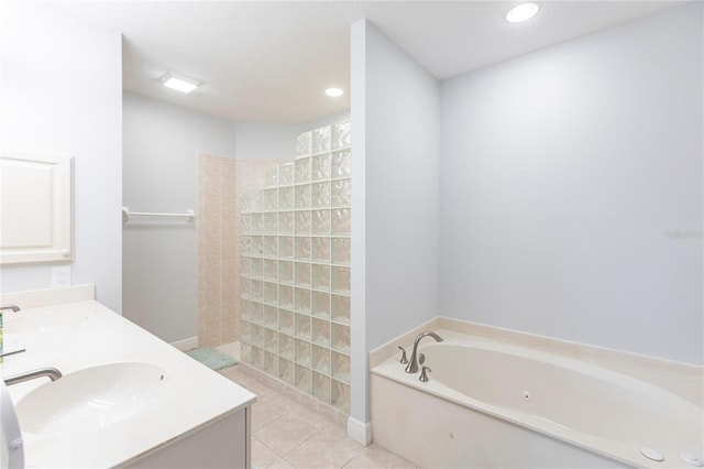 bathroom featuring shower with separate bathtub, tile patterned floors, and vanity