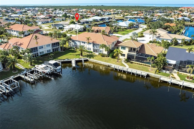 birds eye view of property featuring a water view