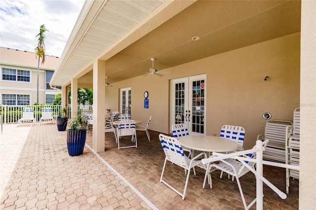 view of patio / terrace featuring ceiling fan and french doors