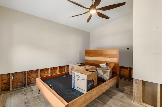 unfurnished bedroom with lofted ceiling and ceiling fan