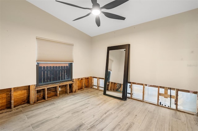 unfurnished room with ceiling fan, lofted ceiling, and light hardwood / wood-style floors