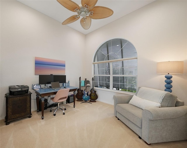 carpeted office featuring high vaulted ceiling and ceiling fan