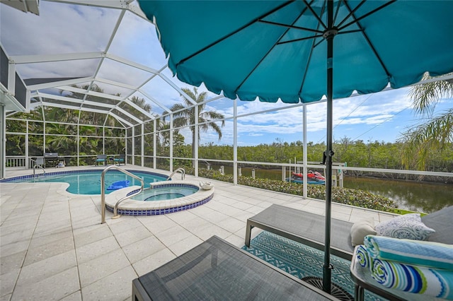 view of swimming pool with a water view, a patio, an in ground hot tub, and glass enclosure