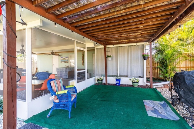 view of patio / terrace with grilling area and a sunroom