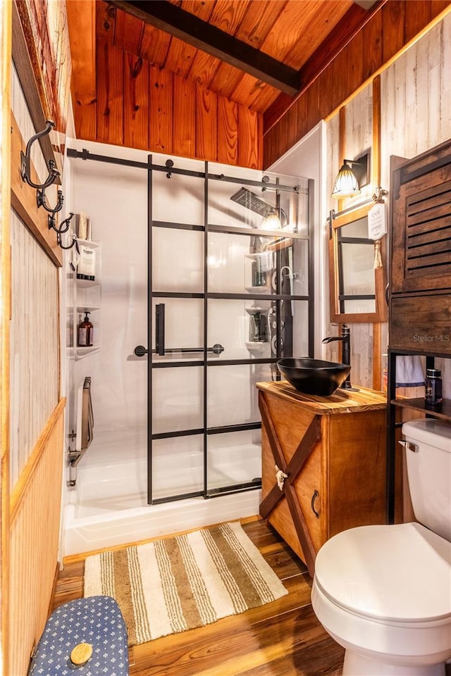 bathroom with wood ceiling, vanity, wood-type flooring, a shower with shower door, and toilet