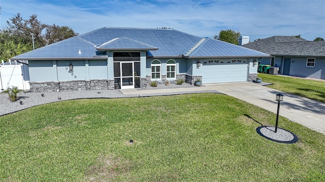 ranch-style house with cooling unit, a garage, and a front yard