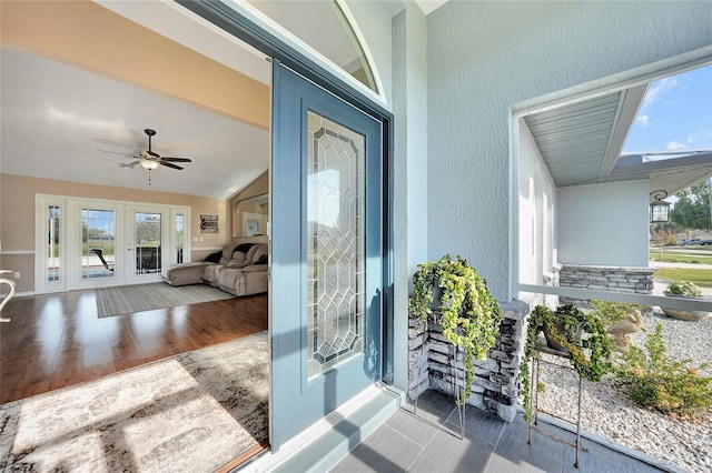 property entrance with french doors and ceiling fan