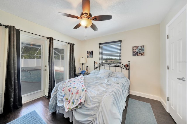 bedroom featuring dark wood-type flooring, ceiling fan, a textured ceiling, and access to outside