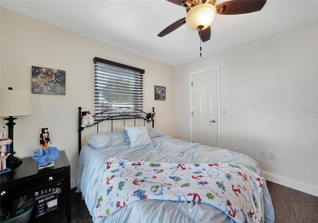 bedroom featuring dark wood-type flooring and ceiling fan