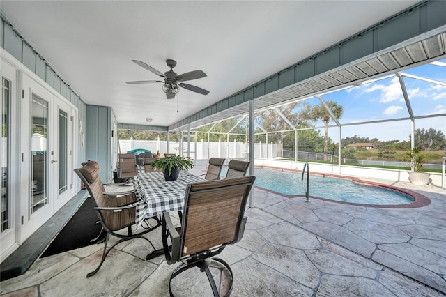 exterior space featuring a patio, a lanai, ceiling fan, and french doors