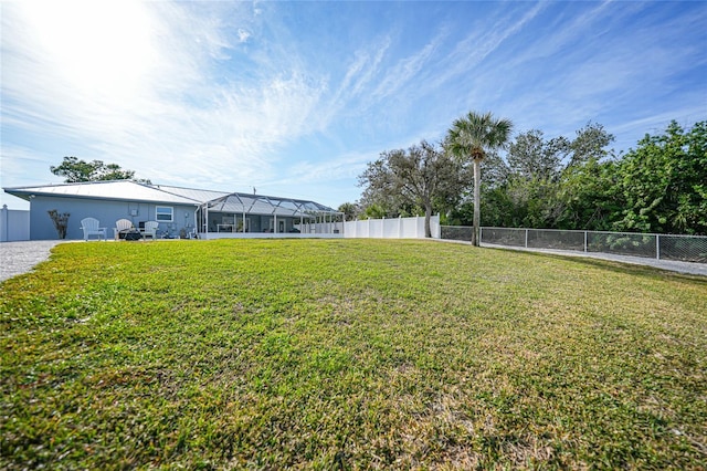 view of yard featuring glass enclosure