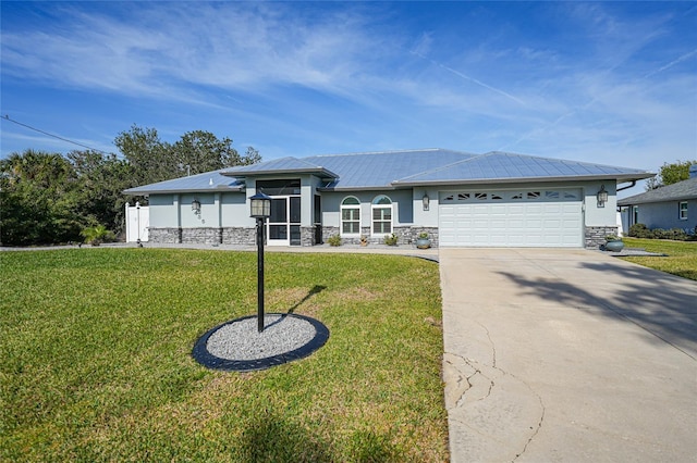 view of front of house with a garage and a front lawn