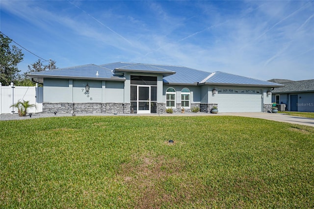 view of front facade featuring a garage and a front lawn