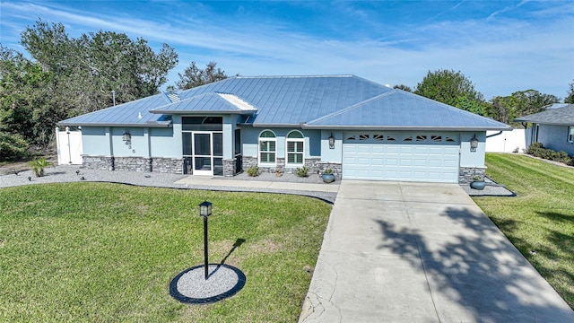 ranch-style house featuring a garage and a front yard