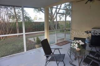 sunroom featuring ceiling fan