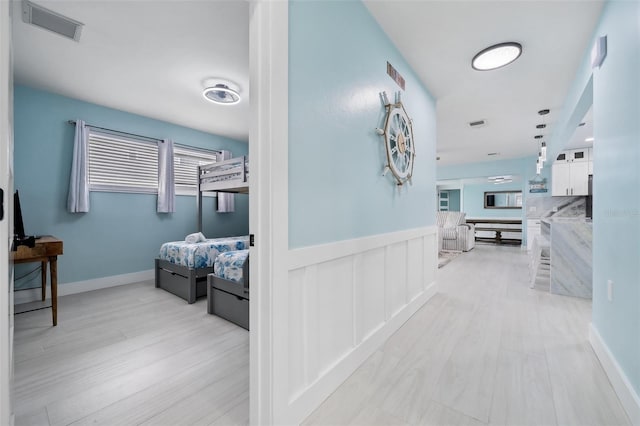 corridor featuring light hardwood / wood-style floors