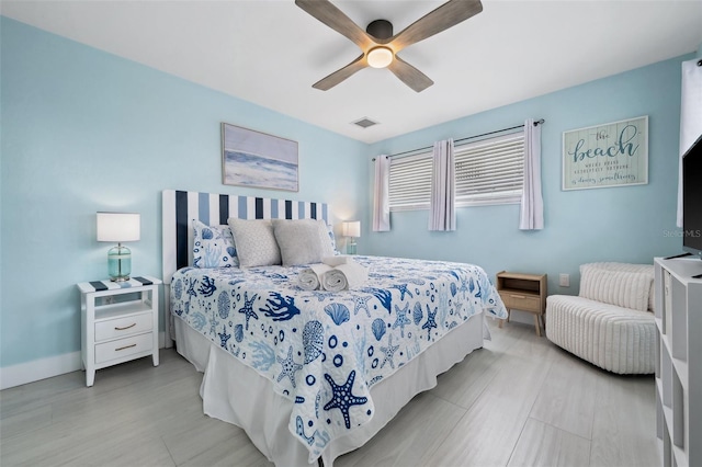 bedroom featuring light wood-type flooring and ceiling fan