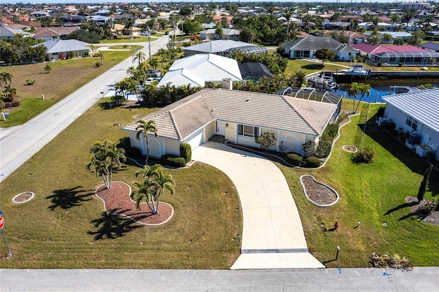 birds eye view of property featuring a water view