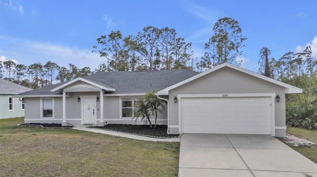 single story home with a garage and a front lawn