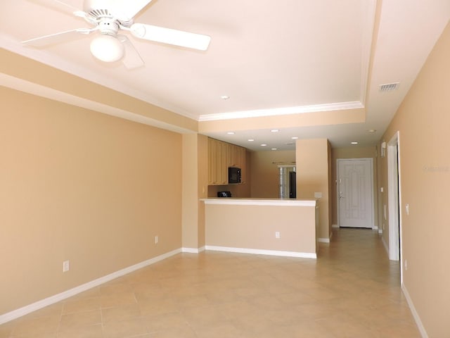 interior space featuring ceiling fan and ornamental molding