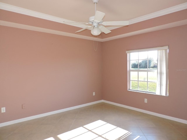 tiled spare room with ceiling fan and ornamental molding