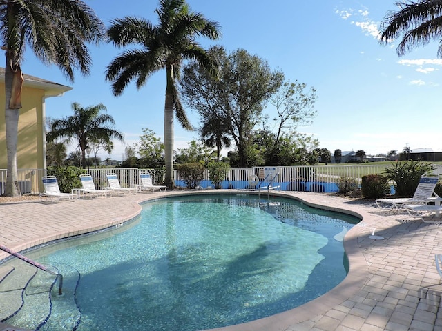 view of swimming pool featuring a patio