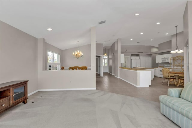 living room featuring an inviting chandelier, light colored carpet, and lofted ceiling