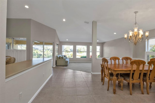 tiled dining room featuring vaulted ceiling and a notable chandelier