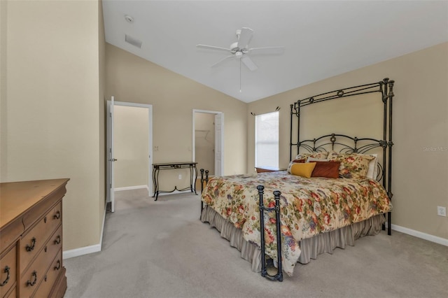 bedroom with ceiling fan, vaulted ceiling, and light carpet