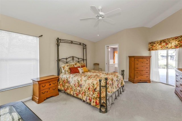 carpeted bedroom featuring lofted ceiling, connected bathroom, access to exterior, and ceiling fan