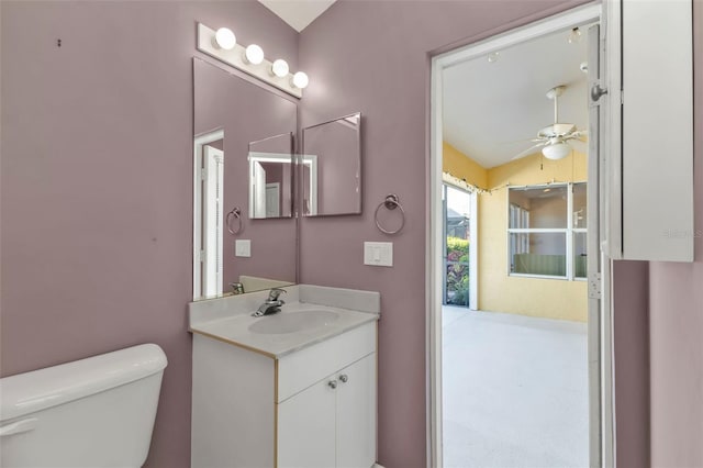 bathroom with vanity, ceiling fan, and toilet