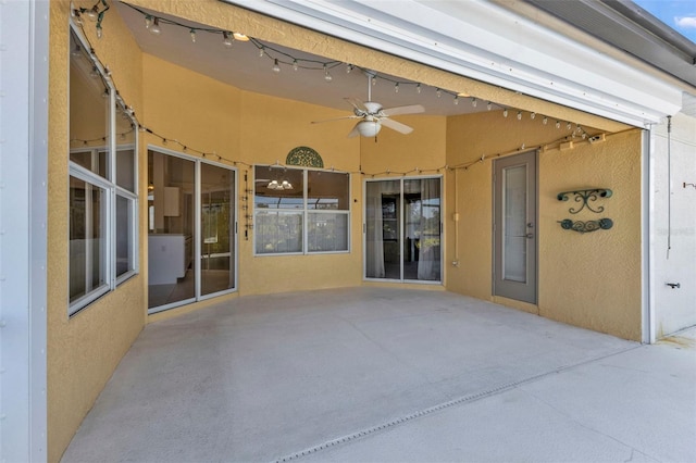 view of patio featuring ceiling fan