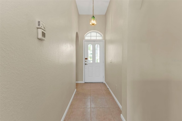 entryway with light tile patterned floors