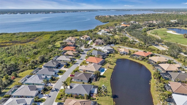 bird's eye view with a water view