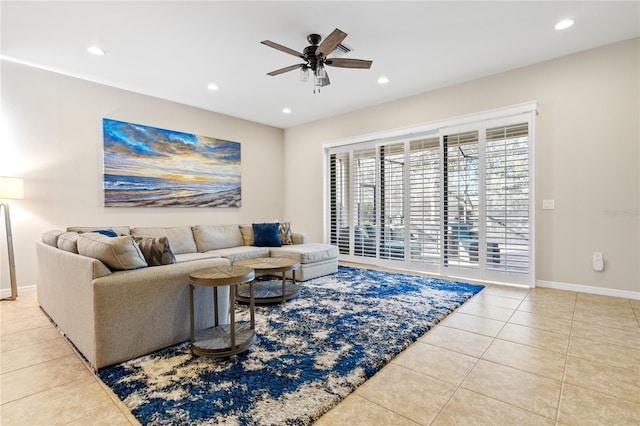 tiled living room featuring ceiling fan