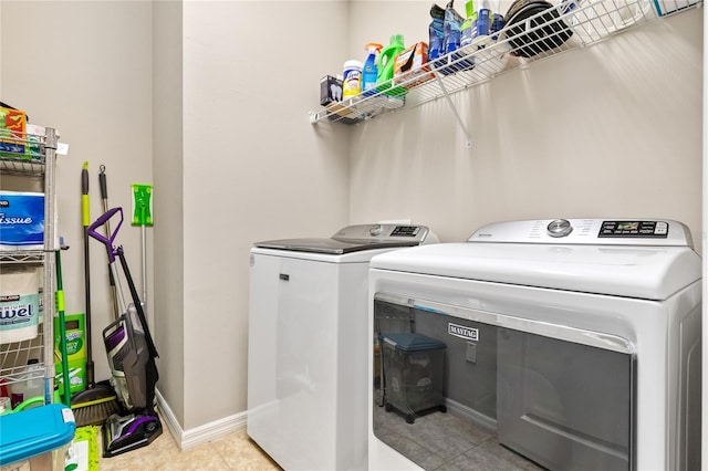 laundry area with washing machine and clothes dryer