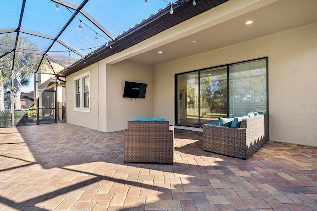 view of patio / terrace with an outdoor living space and a lanai