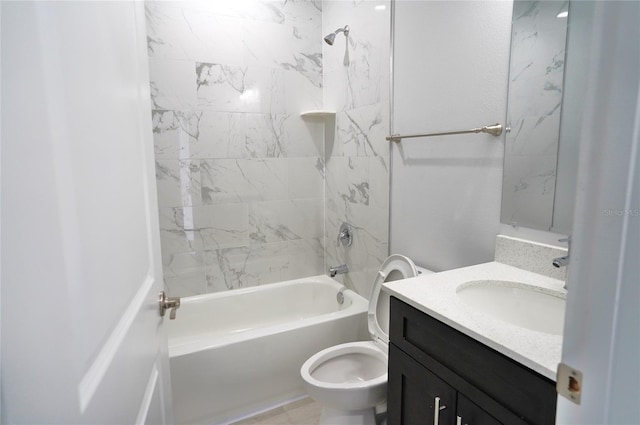 full bathroom with tiled shower / bath, vanity, and toilet