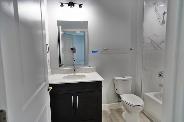 full bathroom featuring vanity, shower / bathing tub combination, wood-type flooring, and toilet