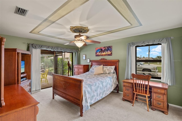 bedroom with ceiling fan, light colored carpet, and access to exterior